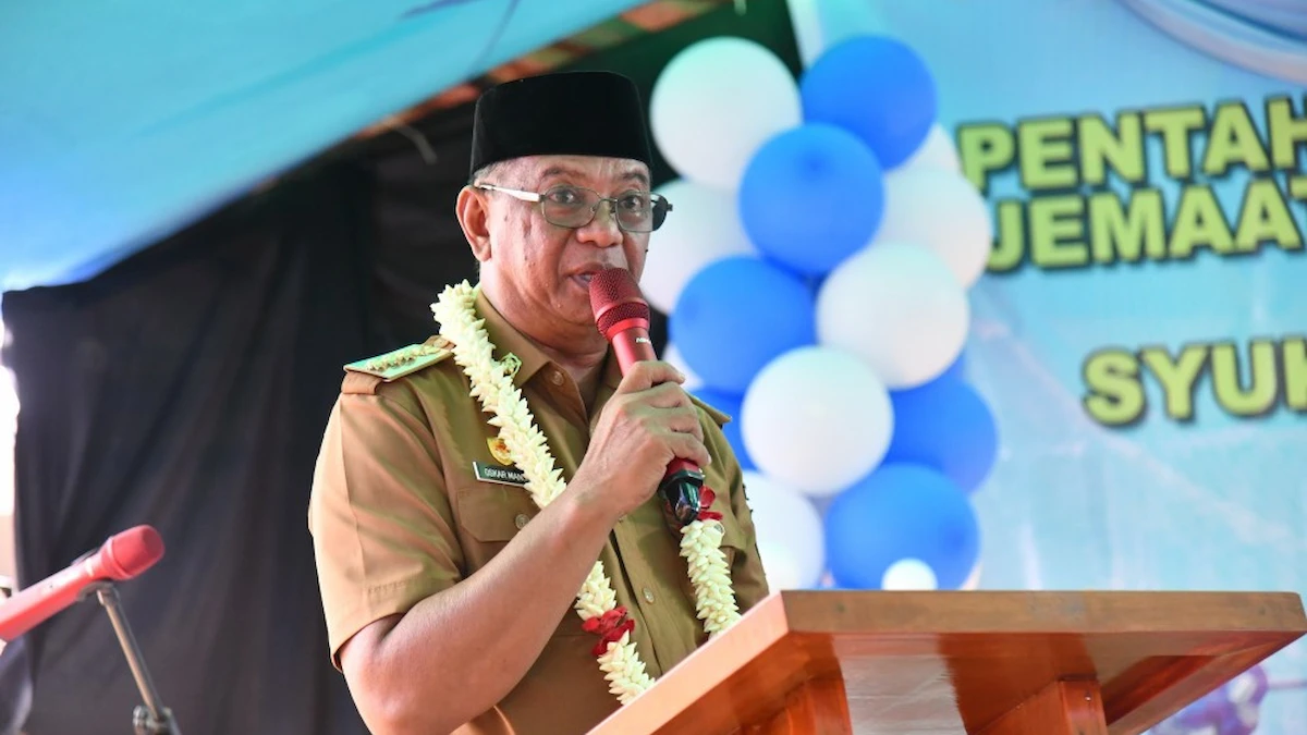 Bupati Oskar Manoppo memberikan sambutan pada peresmian Pastori GMIBM Musafir Kotabunan