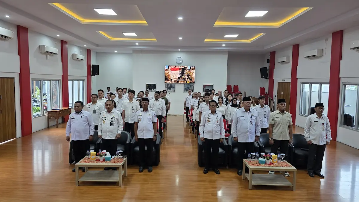 Jajaran Pemkab Bolaang Mongondow Timur dan Kanwil Kemenkum Sulut foto bersama usai penandatanganan kesepakatan pelayanan hukum sulutviral.info